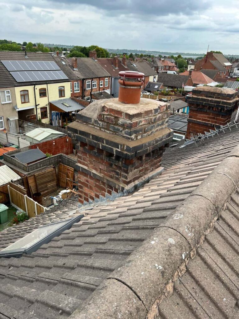 This is a photo taken from a roof which is being repaired by MCM Roofing Repairs Lymington, it shows a street of houses, and their roofs